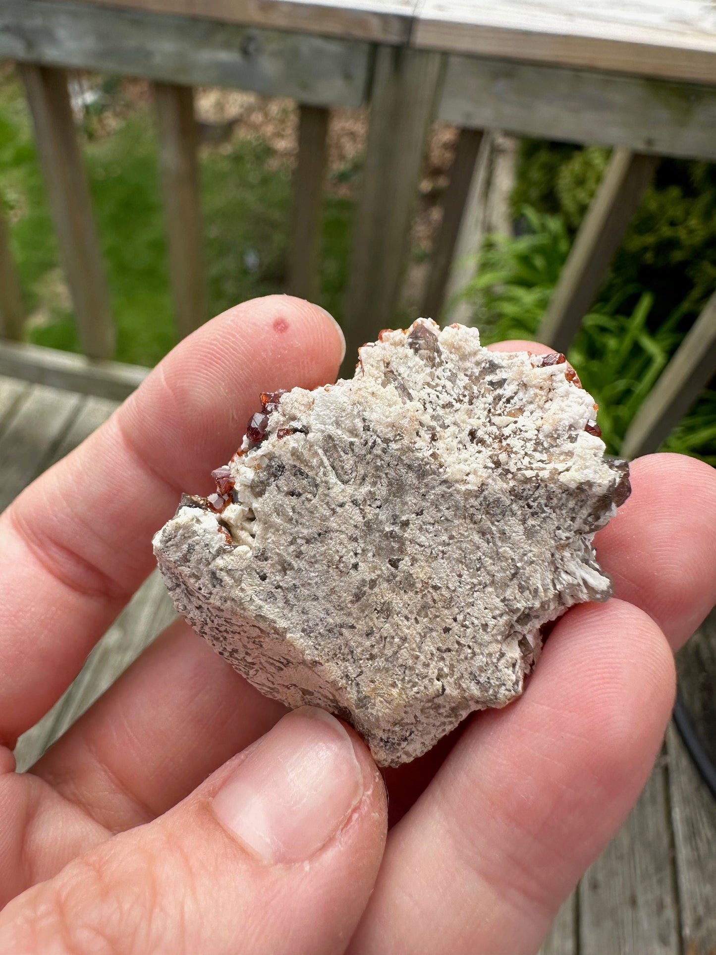 Spessartine Garnets on and in Smoky Quartz on Matrix from China
