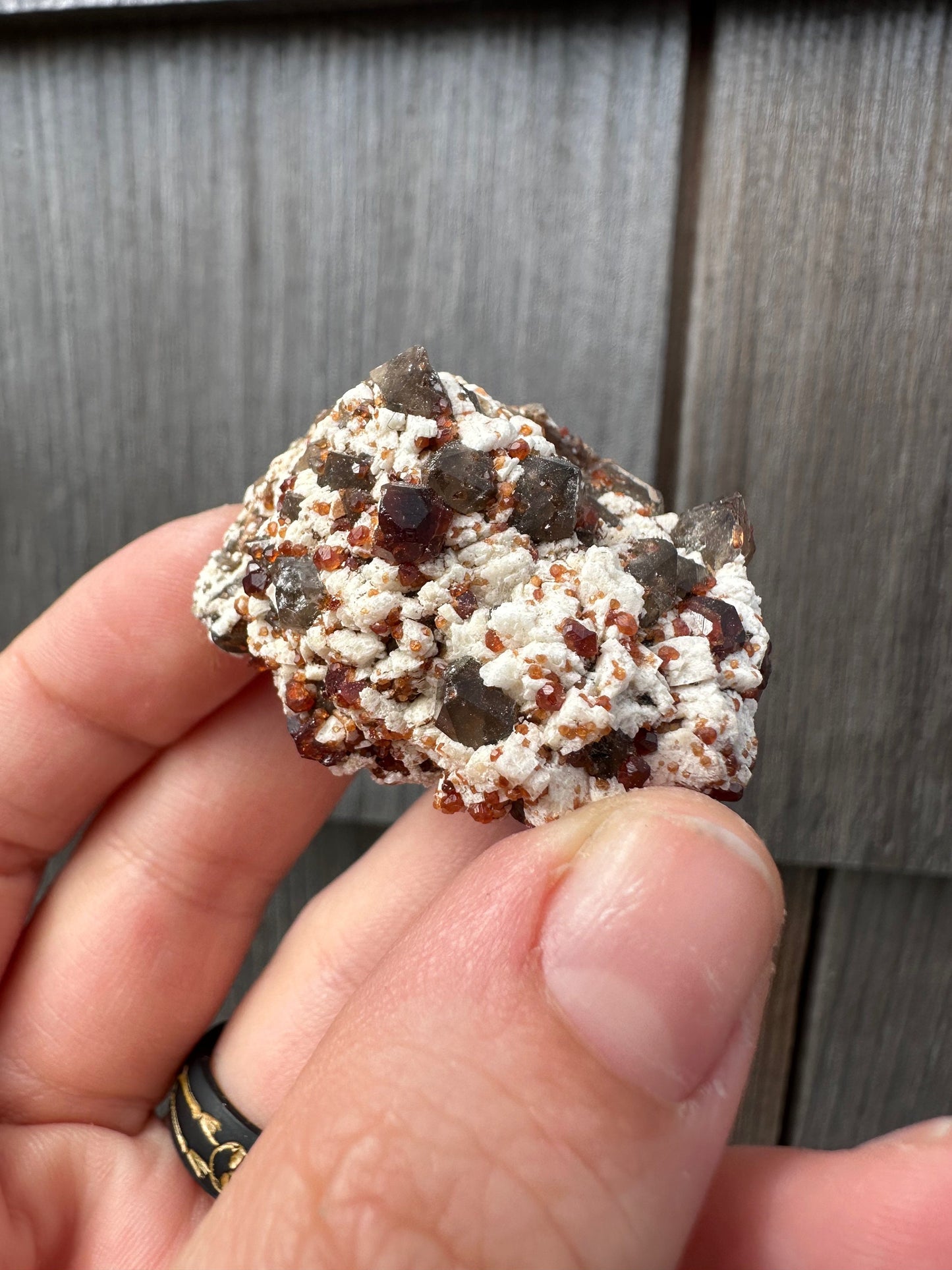 Spessartine Garnets on and in Smoky Quartz on Matrix from China