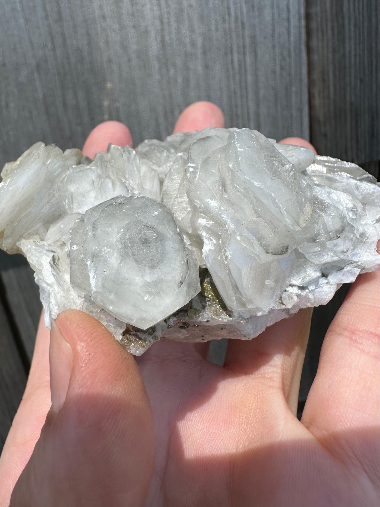 Fluorescent Poker Chip Calcite With Pyrite on Fluorite from Morocco